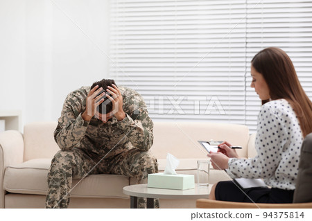Psychotherapist working with male military officer in office Psychotherapist working with male military officer in office 94375814