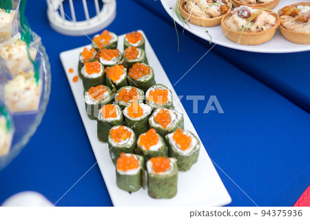 Snacks on the table at a festive event or dinner Snacks on the table at a festive event or dinner 94375936