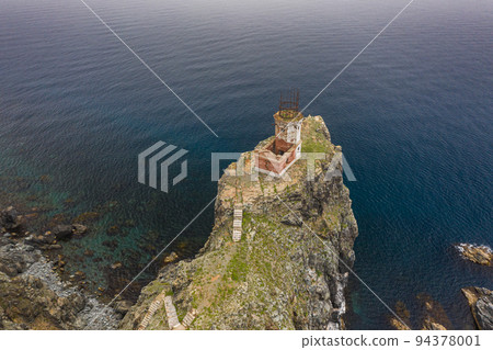 An old ruined lighthouse on Askold Island in the East Sea 94378001