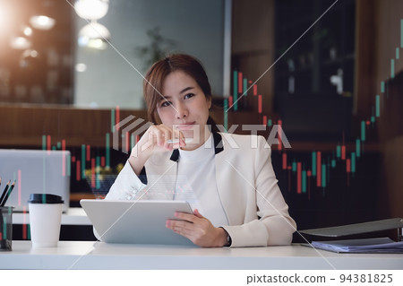 digital technology, Business woman using tablet to trade charts to find buy and sell points for her port. digital technology, Business woman using tablet to trade charts to find buy and sell points for her port. 94381825