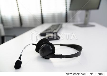 Close up image of headphones for competent online working. Close up image of headphones for competent online working. 94387080