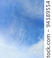Blue cloudy sky in vertical background 94389554