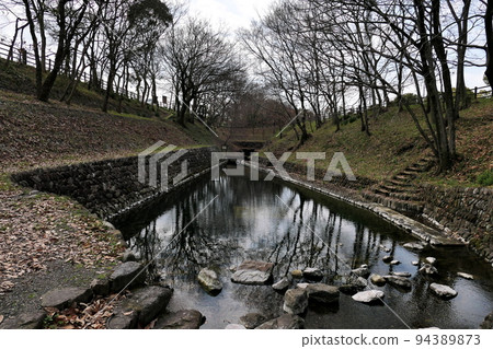A river-like spring surrounded by forest A river-like spring surrounded by forest 94389873