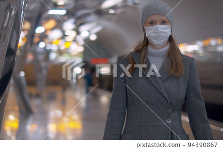 Woman in mask on subway station Woman in mask on subway station 94390867