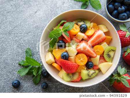 Healthy fresh fruit salad in a bowl 94391829