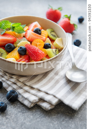 Healthy fresh fruit salad in a bowl 94391830