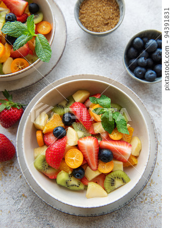 Healthy fresh fruit salad in a bowl 94391831