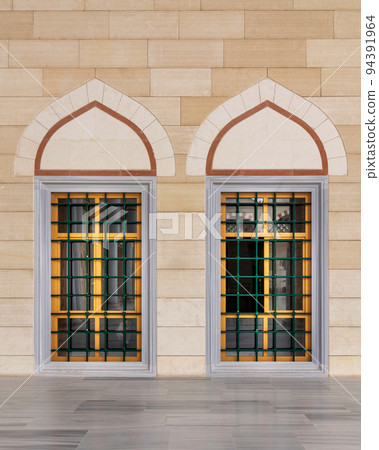 Two wrought iron arched windows with modern architectural design at the courtyard of Camlica Mosque, Istanbul, Turkey 94391964