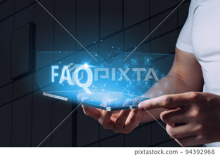 Concept of questions and answers or FAQ. A holographic display with icons is held by a person 94392968