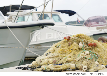 Fishing nets closeup. Bunch of fishing nets tangled together. fishermen backdrop Fishing nets closeup. Bunch of fishing nets tangled together. fishermen backdrop 94393992