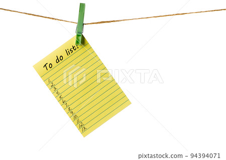 New Year New Goals. Yellow Sticky Note Paper on a clothesline isolated on white. To do list 94394071