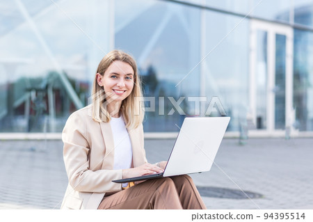 longing young woman sitting alone on street sidewalk on urban background modern building. Sad girl Student or businesswoman misses. Unemployed female lost her job, upset and lonely thoughtful, pensive longing young woman sitting alone on street sidewalk on urban background modern building. Sad girl Student or businesswoman misses. Unemployed female lost her job, upset and lonely thoughtful, pensive 94395514