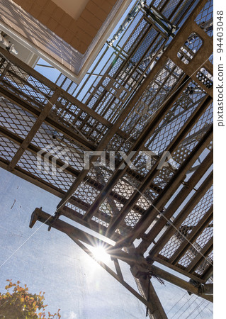 Scaffolding installed for 25-year-old detached roof exterior wall construction Scaffolding installed for 25-year-old detached roof exterior wall construction 94403048