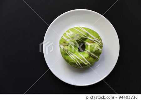 Sweet donuts donuts on a white plate. American delicious and sweet donuts . Sweet donuts donuts on a white plate. American delicious and sweet donuts . 94403736