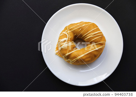 Sweet donuts donuts on a white plate. American delicious and sweet donuts . Sweet donuts donuts on a white plate. American delicious and sweet donuts . 94403738