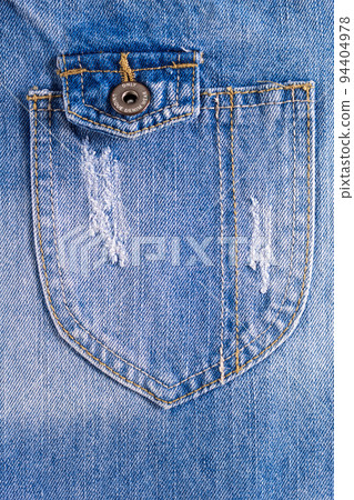 Torn jeans pocket denim background texture. Blue jeans fabric as material Torn jeans pocket denim background texture. Blue jeans fabric as material 94404978