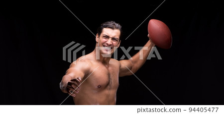 Ripped muscular man with american football Ripped muscular man with american football 94405477