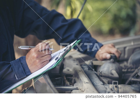 Mechanic car service auto garage in automotive mobile center. Technician workshop repair engine motor vehicles service mechanical engineering business. Automobile mechanic hands car repairs technic Mechanic car service auto garage in automotive mobile center. Technician workshop repair engine motor vehicles service mechanical engineering business. Automobile mechanic hands car repairs technic 94405765