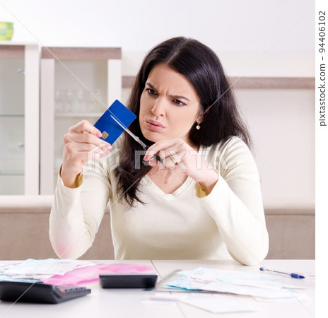 Young woman with receipts in budget planning concept Young woman with receipts in budget planning concept 94406102