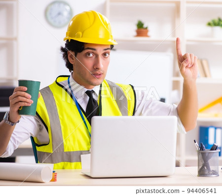 Male construction engineer working in the office Male construction engineer working in the office 94406541
