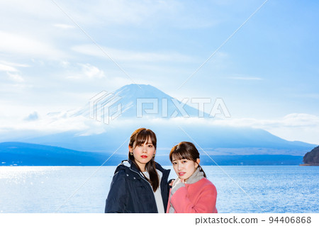 Two women enjoying Mt. Fuji from Lake Yamanaka on a girls' trip Two women enjoying Mt. Fuji from Lake Yamanaka on a girls' trip 94406868