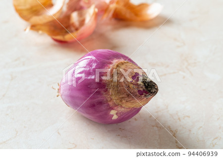 Rotting of whole red shallot bulb macro. Rotting of whole red shallot bulb macro. 94406939