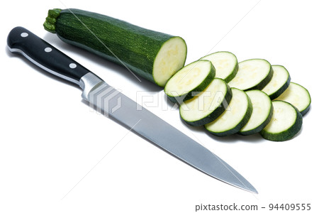 sliced in circles green natural organic zucchini vegetable isolated on white background 94409555