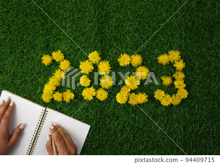 The numbers 2023 are laid out on the green lawn The numbers 2023 are laid out on the green lawn 94409715