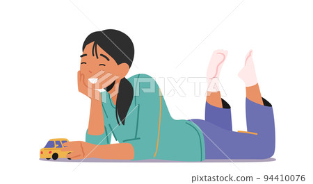 Little Girl with Car Toy in hands, Child Playing Concept. Kid Lying Down on Floor Having Fun and Recreation at Home 94410076