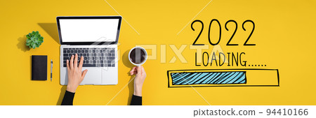 Loading new year 2022 with person using laptop computer Loading new year 2022 with person using laptop computer 94410166