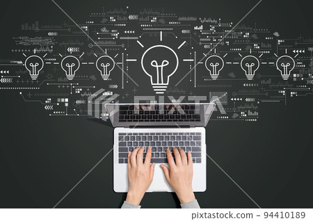 Idea light bulb theme with person using laptop Idea light bulb theme with person using laptop 94410189