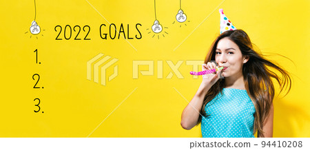 2022 goals with young woman with party theme 2022 goals with young woman with party theme 94410208