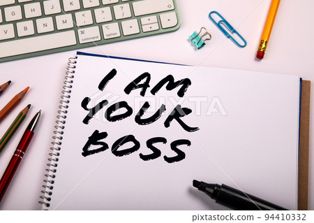 I Am Your Boss. Office supplies on a white table 94410332