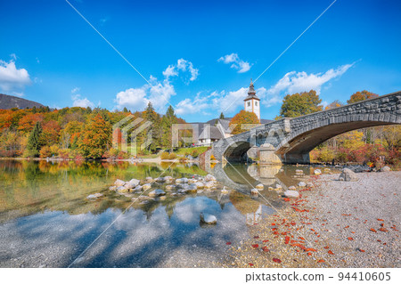 Astonishing  view  of  Church of St. John the Baptist on Bohinj Lake . 94410605