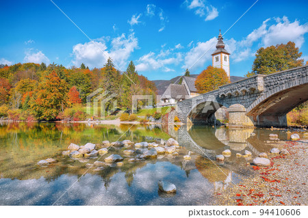 Gorgeous view of Church of St. John the Baptist on Bohinj Lake . Gorgeous view of Church of St. John the Baptist on Bohinj Lake . 94410606