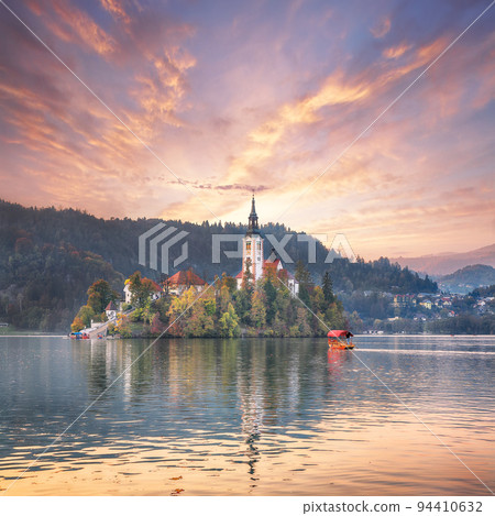 Astonishing sunset view of popular tourist destination Bled lake. Astonishing sunset view of popular tourist destination Bled lake. 94410632