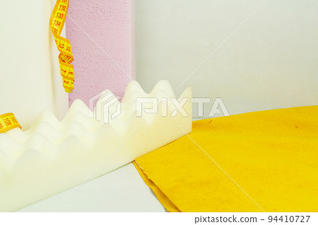 a piece of foam rubber of different sizes and colors, production of upholstered furniture. 94410727