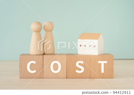 A block with COST written on it, a house and a doll A block with COST written on it, a house and a doll 94412911