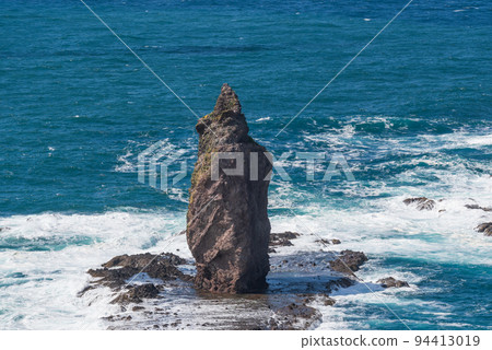 Majestic Kamui Rock with a superb view jutting out into the ocean of Shakotan blue 94413019