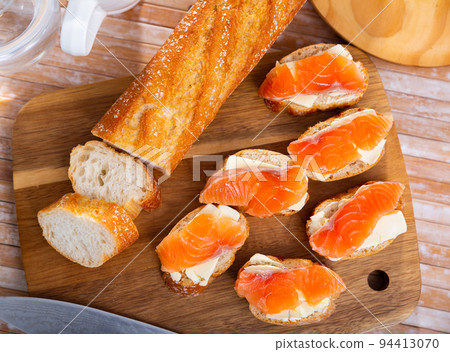 Sandwiches with salmon and butter on white plate Sandwiches with salmon and butter on white plate 94413070