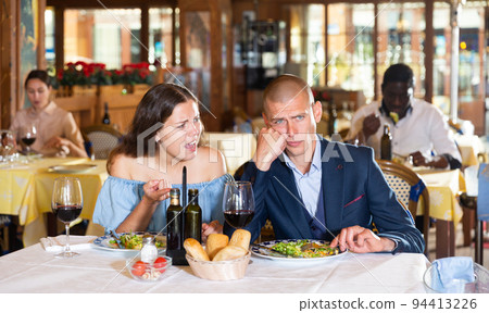 Family quarrel during lunch in restaurant 94413226