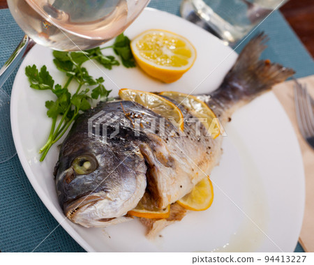 Dorado baked in oven Dorado baked in oven 94413227