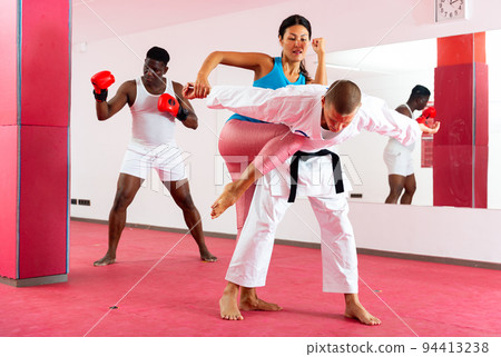 People training martial arts in gym 94413238