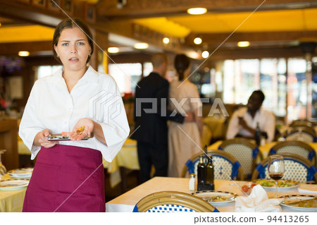 Waiter demonstrating his upset with little tips from restaurant visitors Waiter demonstrating his upset with little tips from restaurant visitors 94413265