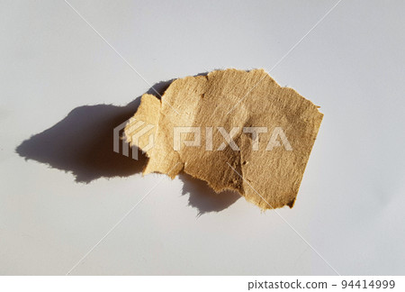 Recycled paper craft stick on a white background. Brown paper torn or ripped pieces of paper isolated on white with clipping path 94414999