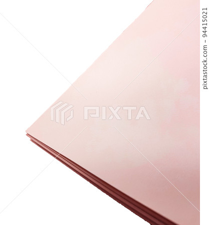 Top view of a stack of pink paper on a white isolated background Top view of a stack of pink paper on a white isolated background 94415021