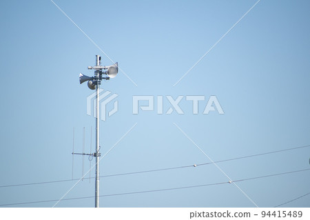 Blue sky and speakers for broadcasting in the town Blue sky and speakers for broadcasting in the town 94415489