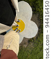 Couple wearing matching shoes in the park 94416450