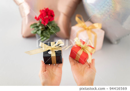 A woman with a present A woman with a present 94416569