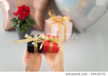 A woman with a present A woman with a present 94416570